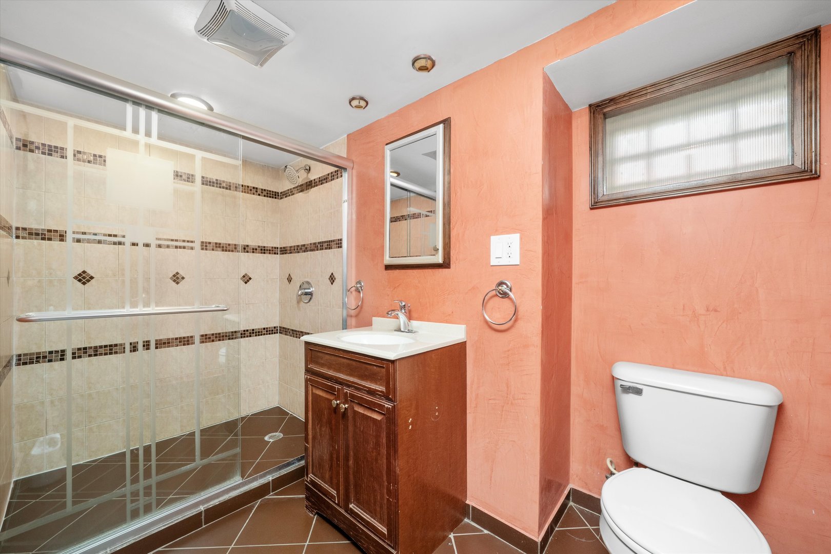 3905 West 81st Place Chicago, IL 60652 - Photo 27 of 32 a bathroom with a toilet a sink and a shower