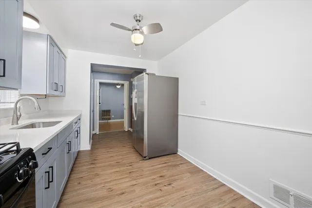 a view of a kitchen with a sink and dishwasher