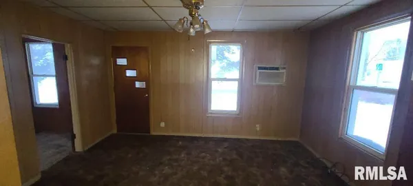 an empty room that has a window in it