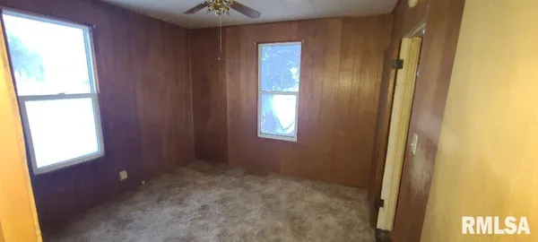 a view of an empty room and a window