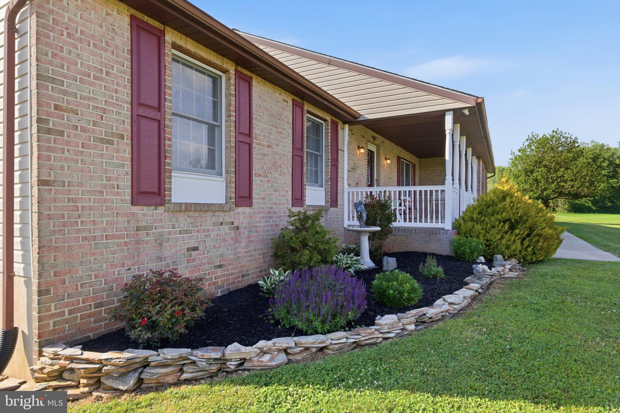 18310 Upper Beckleysville Road Hampstead, MD 21074 - Photo 7 of 67 Charming brick home with lush landscaping.