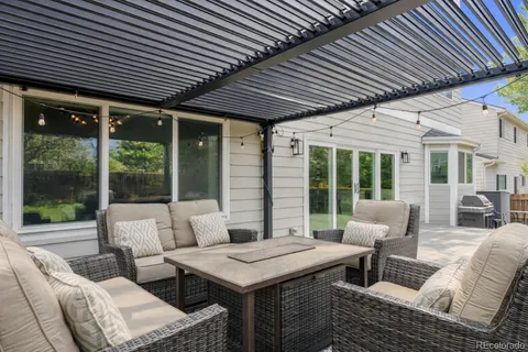 a outdoor space with patio furniture and garden view