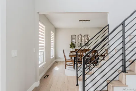 a view of entryway livingroom and hall with wooden floor