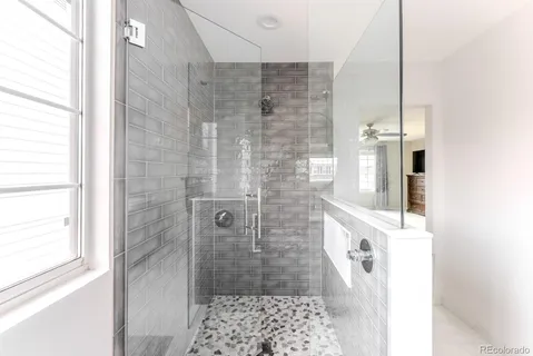 a bathroom with a shower and a sink