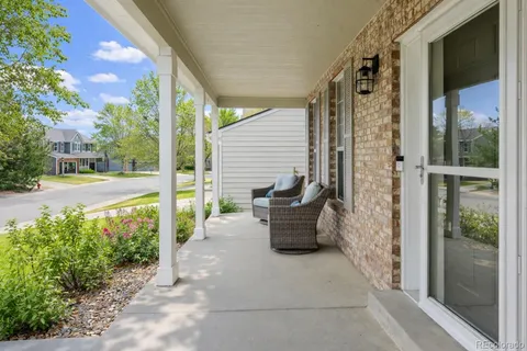 a view of a patio with table and chairs and potted plants