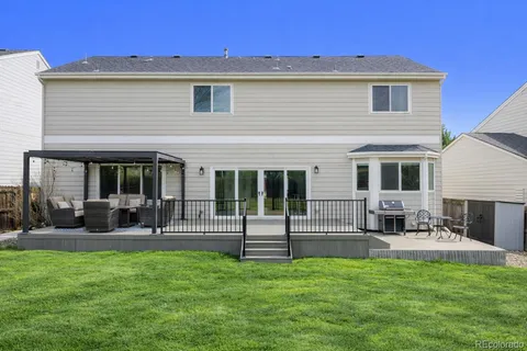 a front view of house with yard and outdoor seating