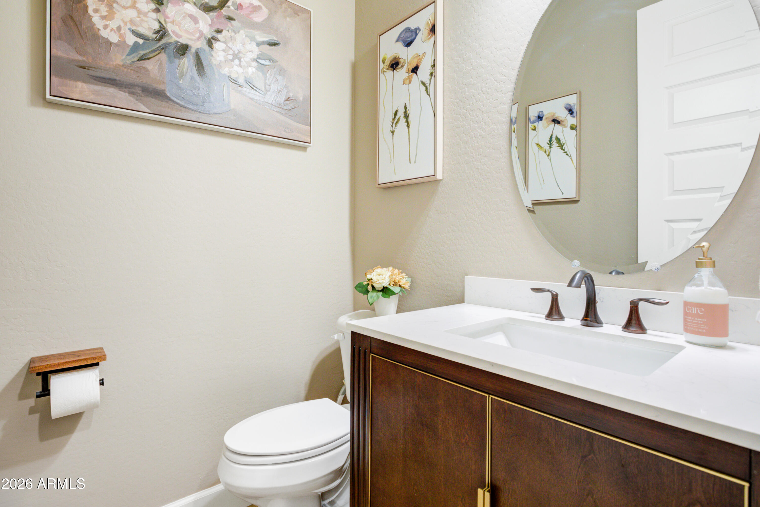 28517 North Camel Rock Court Rio Verde, AZ 85263 - Photo 21 of 39 a bathroom with a toilet a sink and mirror