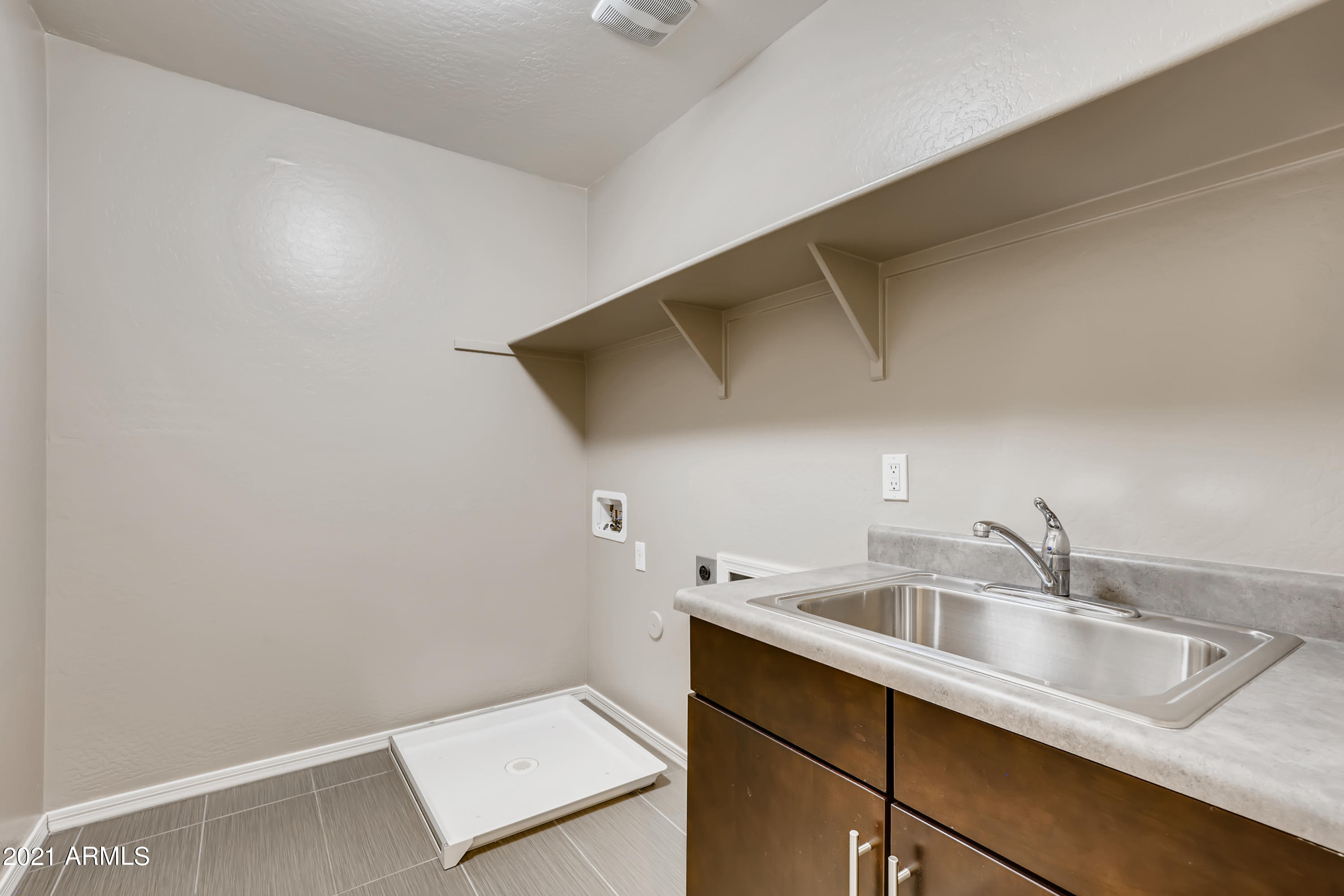 2991 East Megan Street Gilbert, AZ 85295 - Photo 28 of 33 28-064264122-51 2nd Floor Laundry Room