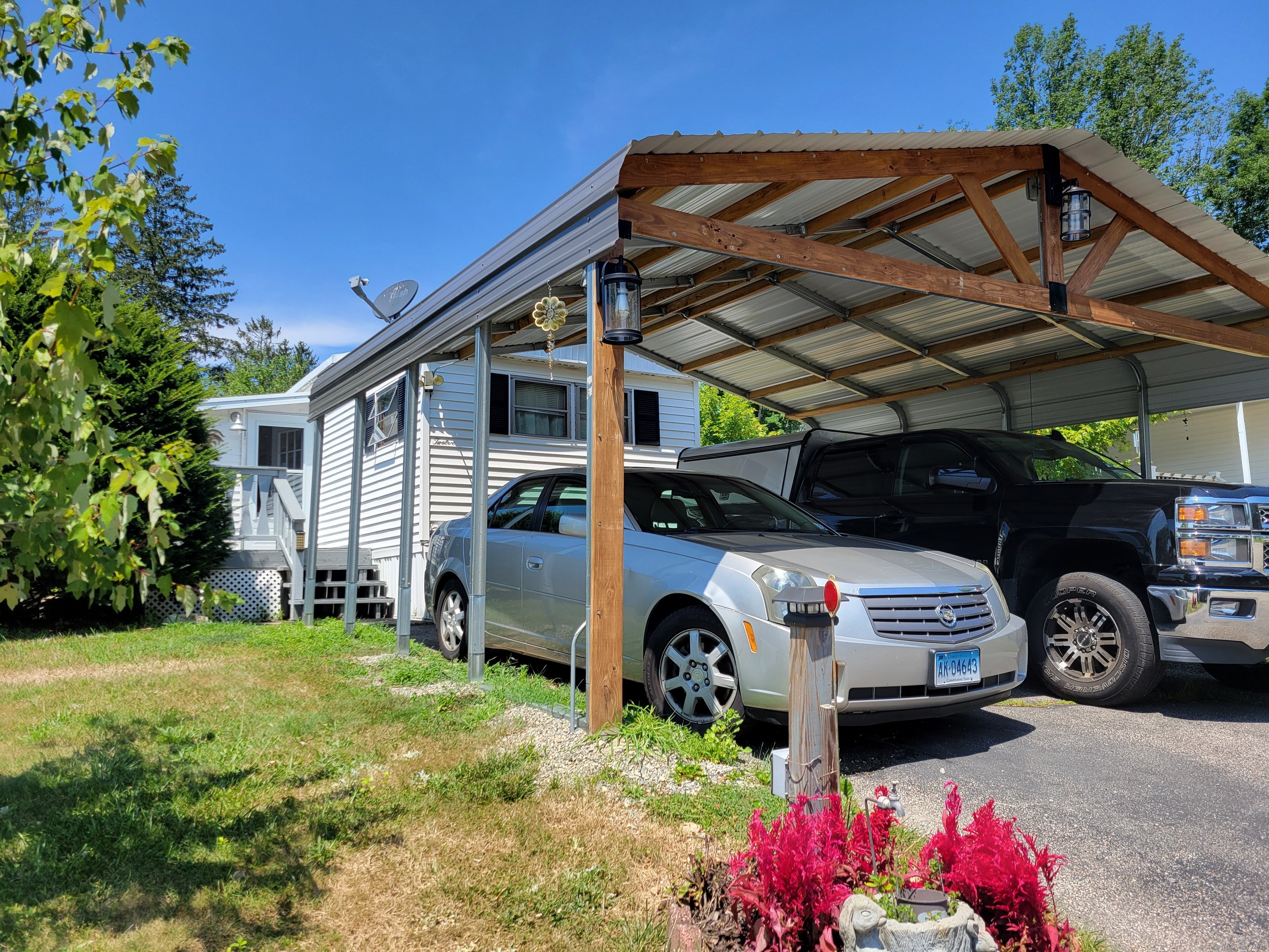 a car parked in front of white house