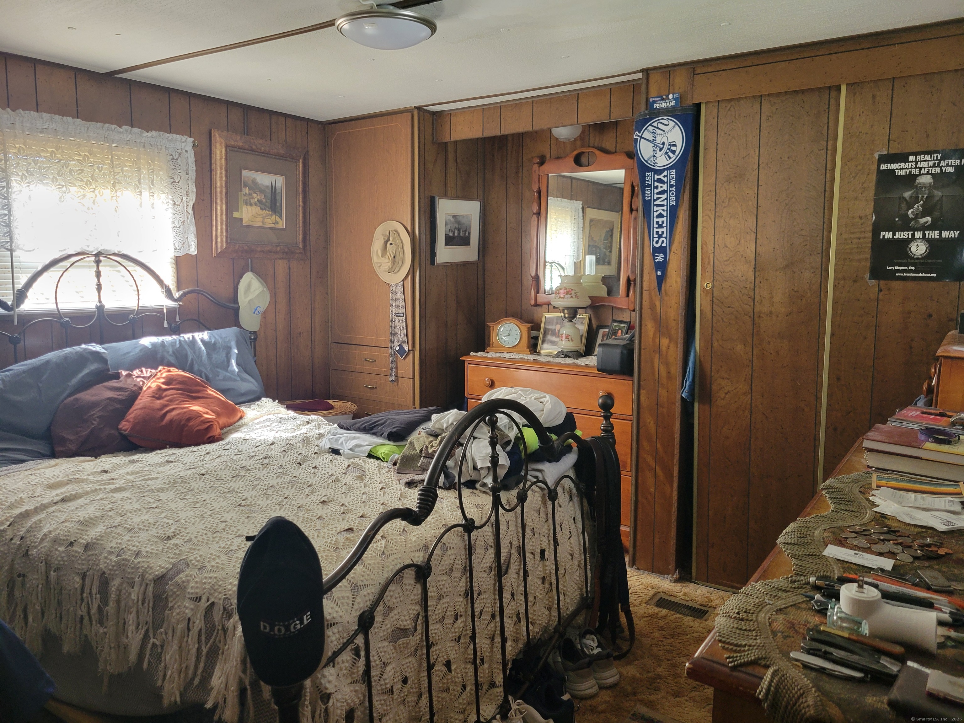 80 Sheldon Road Griswold, CT 06351 - Photo 18 of 25 a bedroom with a bed and a mirror