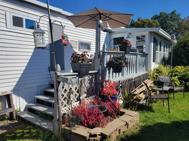 a view of a house with wooden deck