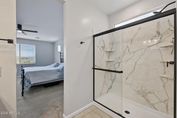 a bathroom with a bathtub and a shower