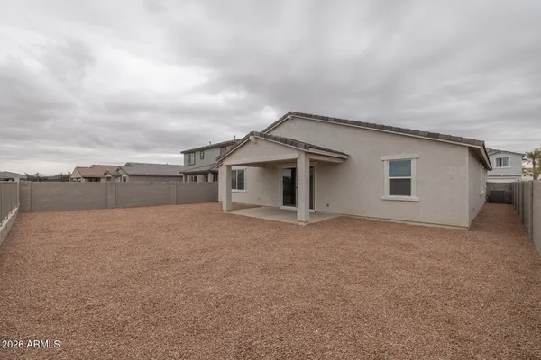 front view of a house with a dry yard