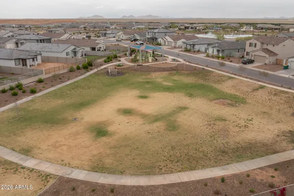 an aerial view of a house with a swimming pool