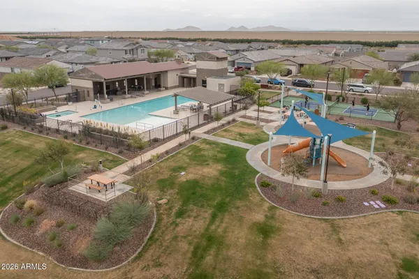 a view of a balcony with chairs and wooden floor