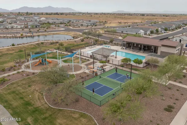 an aerial view of residential houses with outdoor space