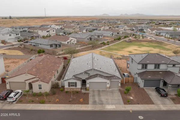 an aerial view of residential houses with outdoor space