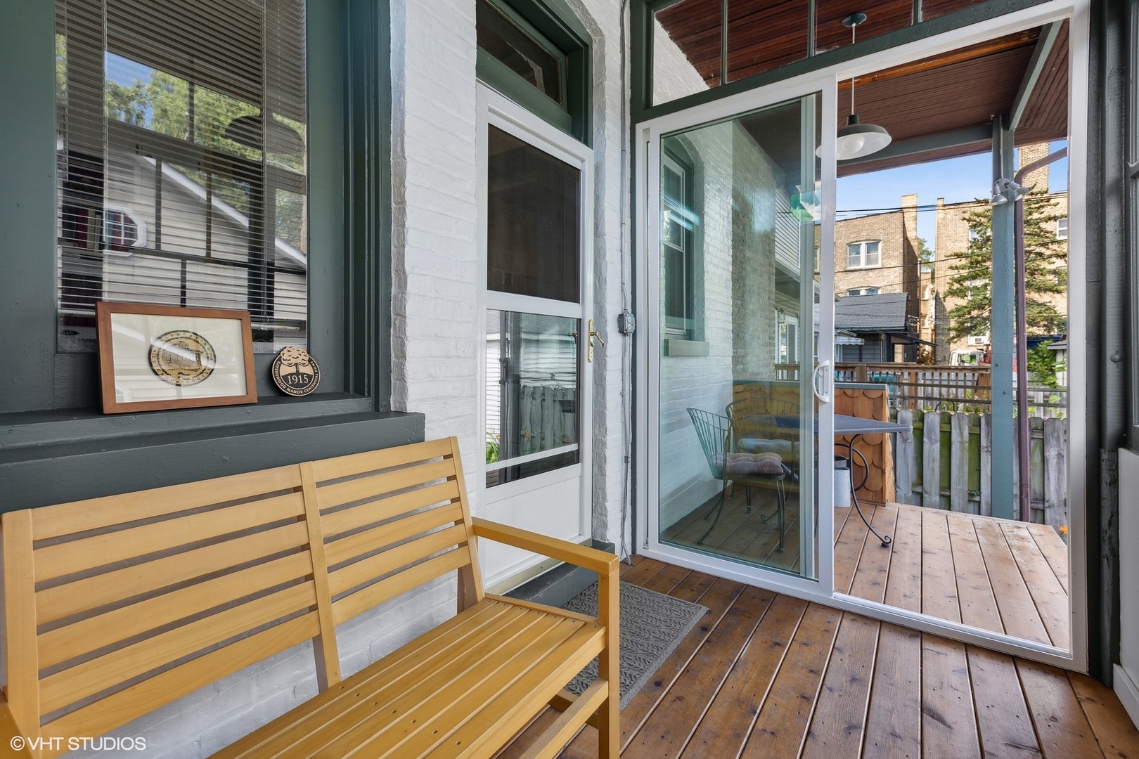 2836 West Eastwood Avenue Chicago, IL 60625 - Photo 12 of 28 a view of a balcony with wooden floor and glass door