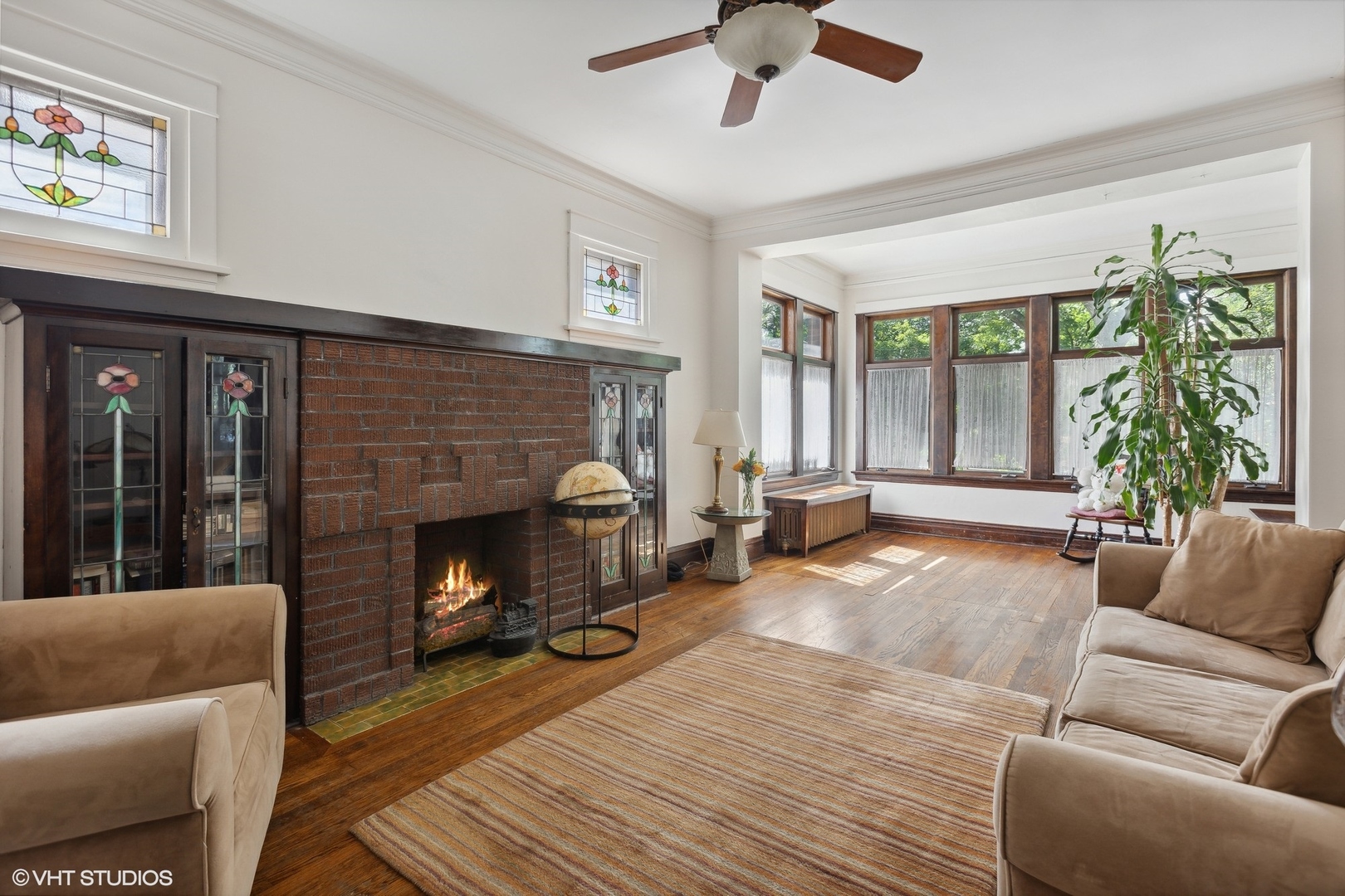 2836 West Eastwood Avenue Chicago, IL 60625 - Photo 3 of 28 a living room with furniture and a fireplace