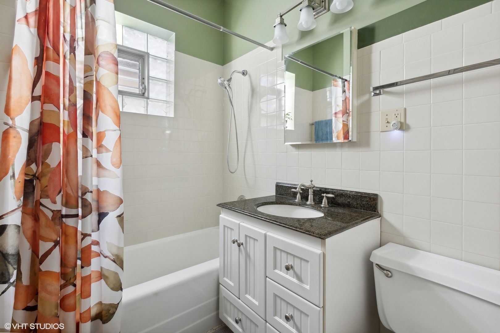 2836 West Eastwood Avenue Chicago, IL 60625 - Photo 7 of 28 a bathroom with a granite countertop sink and a mirror