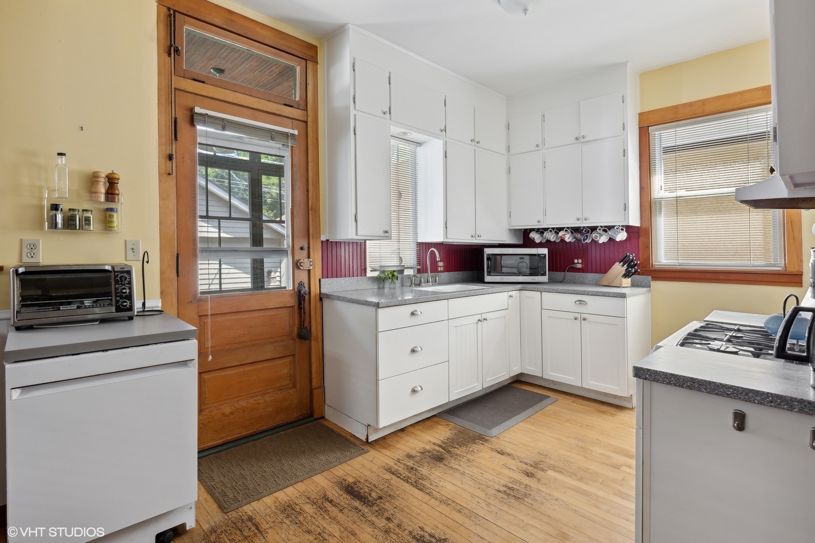 2836 West Eastwood Avenue Chicago, IL 60625 - Photo 9 of 28 a kitchen with white cabinets and white appliances