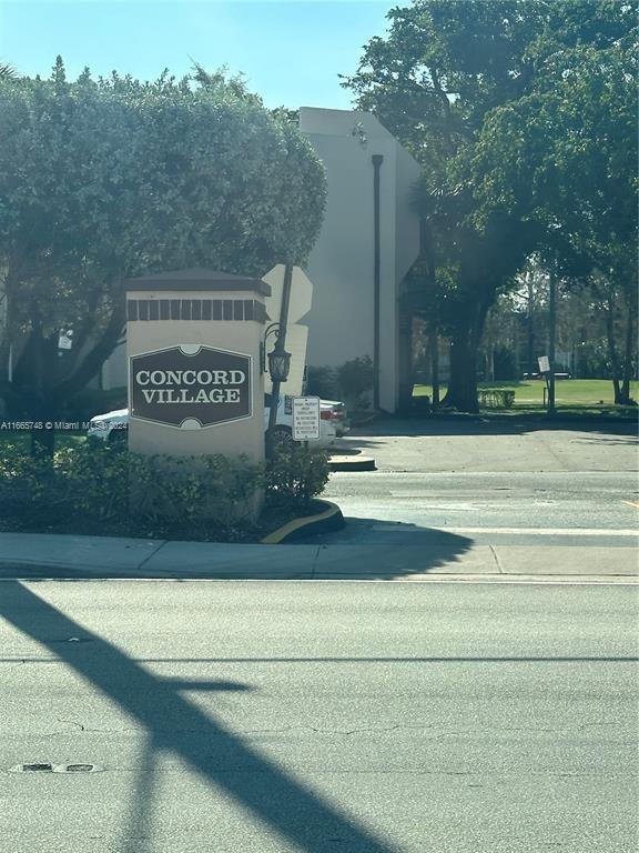 7950 West McNab Road, Unit 106 Tamarac, FL 33321 - Photo 1 of 33 a view of a street sign