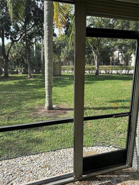 7950 West McNab Road, Unit 106 Tamarac, FL 33321 - Photo 13 of 33 a view of backyard from window