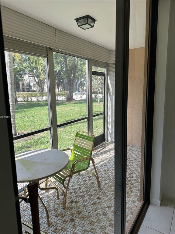 7950 West McNab Road, Unit 106 Tamarac, FL 33321 - Photo 14 of 33 a view of a room with a large window