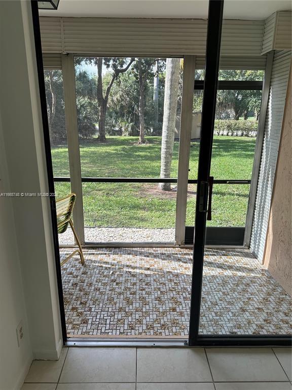 7950 West McNab Road, Unit 106 Tamarac, FL 33321 - Photo 16 of 33 a view of porch with a large window