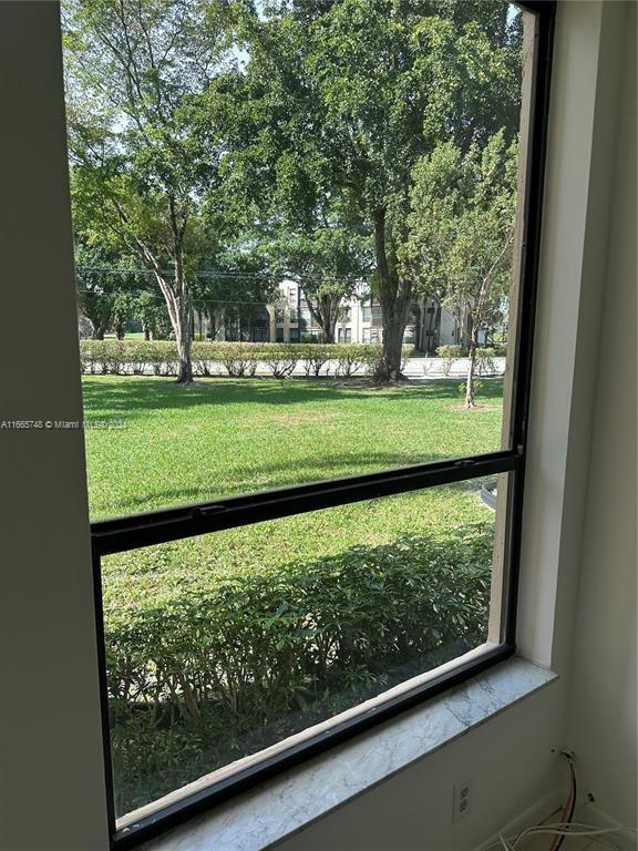 7950 West McNab Road, Unit 106 Tamarac, FL 33321 - Photo 17 of 33 a view of outdoor space with seating area