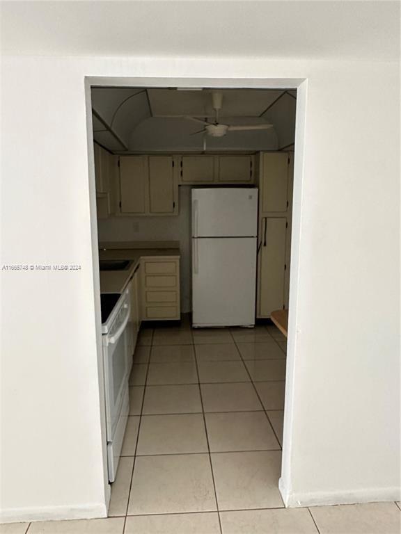7950 West McNab Road, Unit 106 Tamarac, FL 33321 - Photo 20 of 33 a utility room with dryer and washer