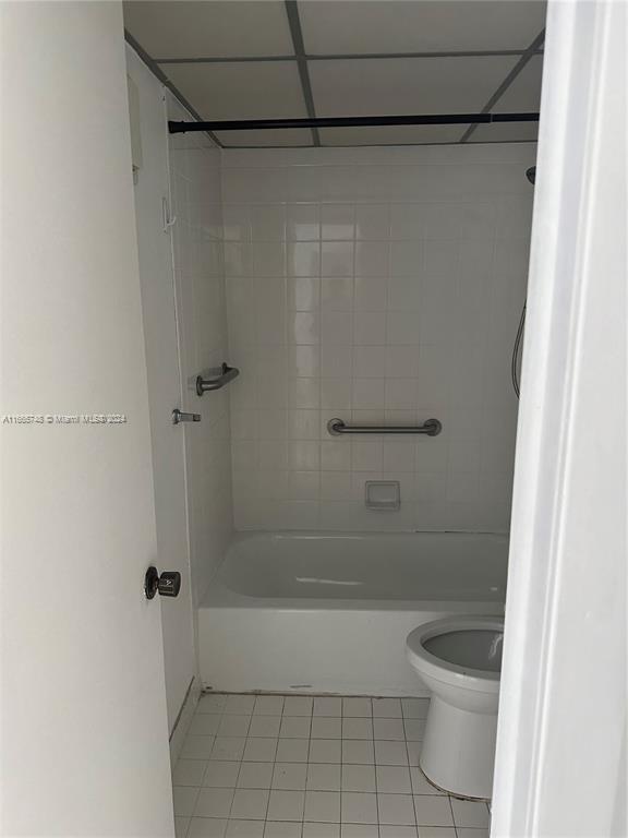 7950 West McNab Road, Unit 106 Tamarac, FL 33321 - Photo 29 of 33 a bathroom with a shower and a toilet