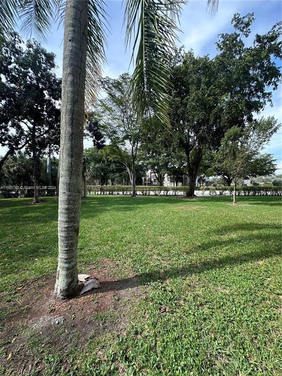 7950 West McNab Road, Unit 106 Tamarac, FL 33321 - Photo 31 of 33 a view of a park with large trees