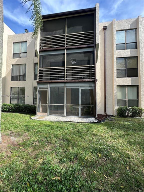 7950 West McNab Road, Unit 106 Tamarac, FL 33321 - Photo 32 of 33 a view of a house with a large window