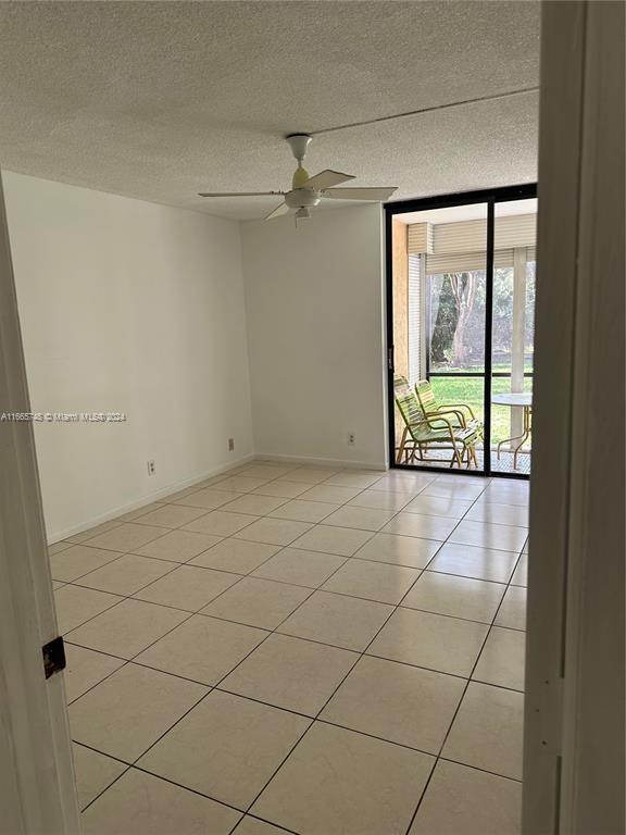 7950 West McNab Road, Unit 106 Tamarac, FL 33321 - Photo 4 of 33 a view of an empty room and a window