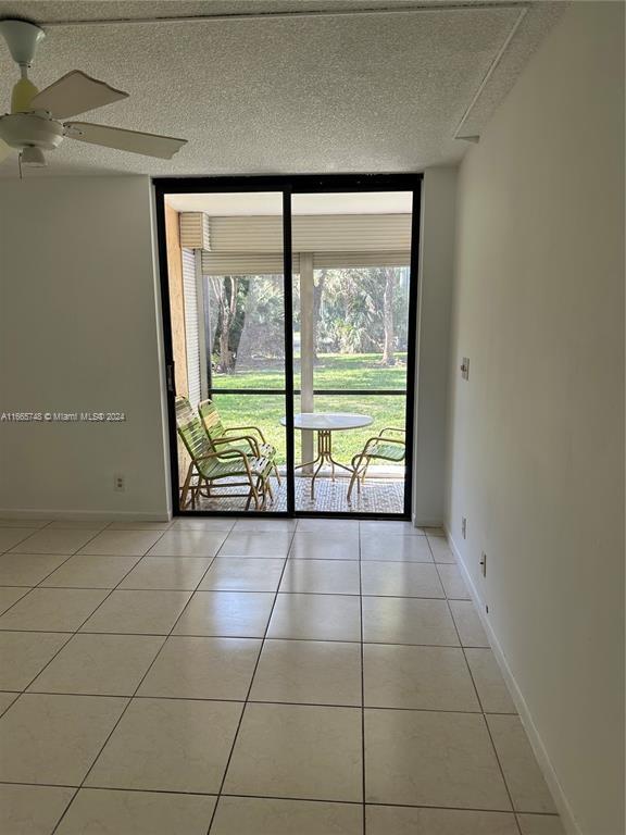7950 West McNab Road, Unit 106 Tamarac, FL 33321 - Photo 5 of 33 a view of an empty room with a large window