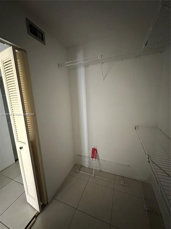 7950 West McNab Road, Unit 106 Tamarac, FL 33321 - Photo 7 of 33 a bathroom with a shower and closet