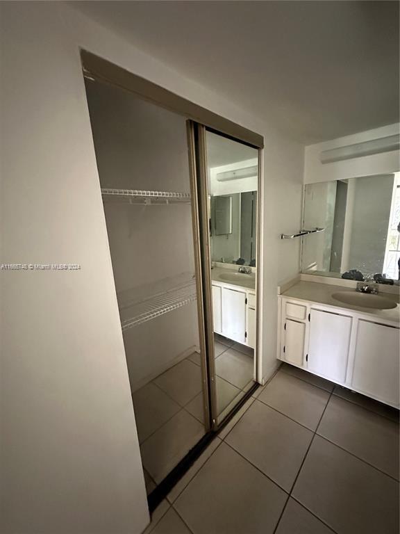 7950 West McNab Road, Unit 106 Tamarac, FL 33321 - Photo 8 of 33 a bathroom with a shower and a sink