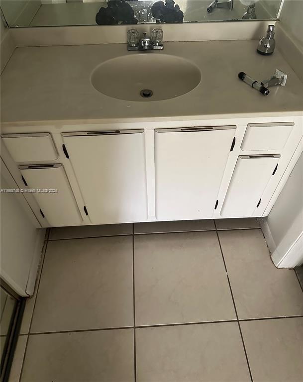 7950 West McNab Road, Unit 106 Tamarac, FL 33321 - Photo 10 of 33 a sink with white cabinets