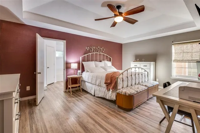 a bedroom with a bed and a table