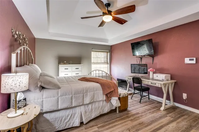 a bedroom with a bed and a table in it