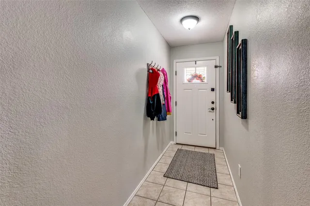 a view of a hallway with white walls