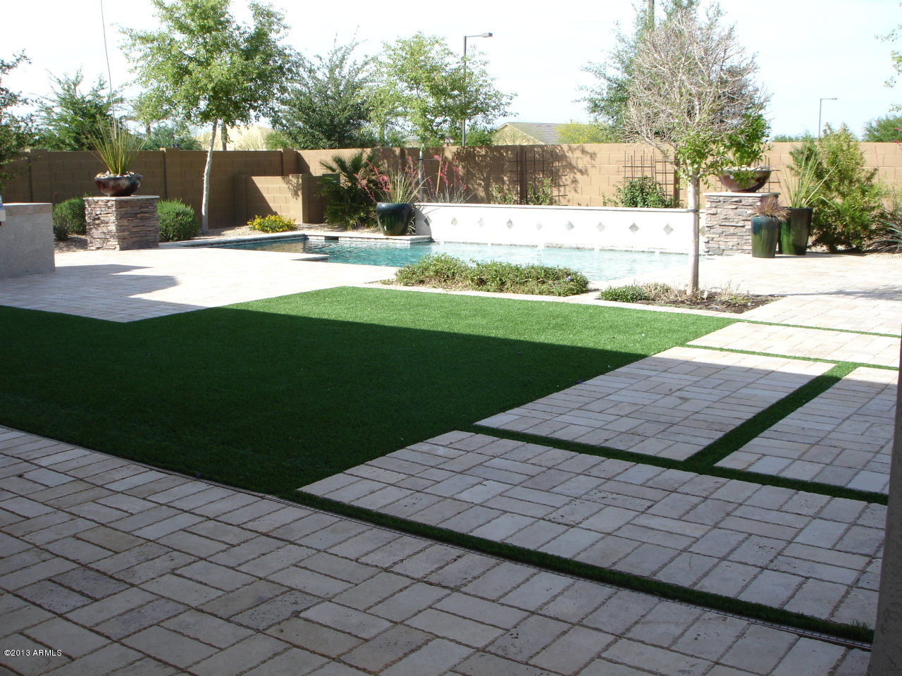 16042 West Berkeley Road Goodyear, AZ 85395 - Photo 66 of 72 Backyard Travertine Tile