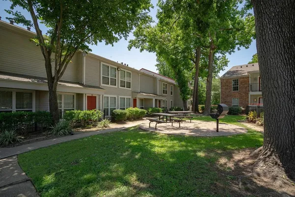 a view of a house with a yard porch and sitting area