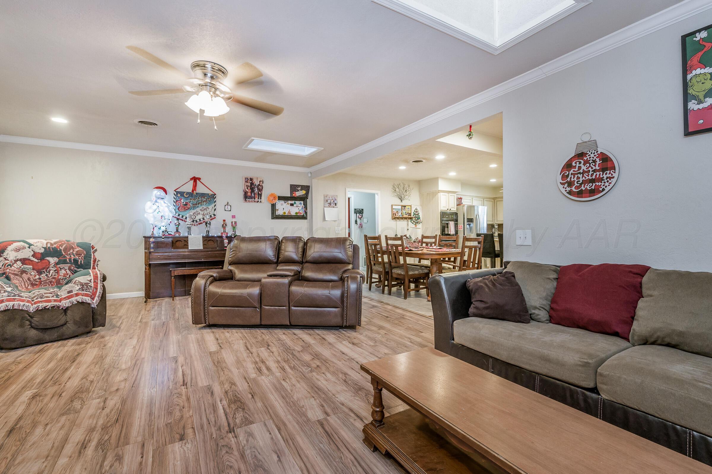 4932 South Georgia Street Amarillo, TX 79110 - Photo 6 of 23 a living room with furniture and wooden floor