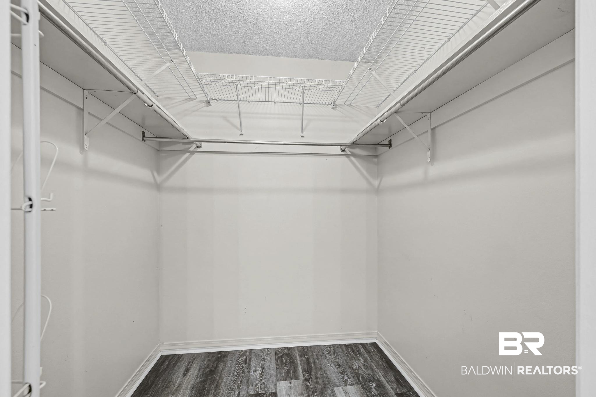 2776 Santa Rosa Circle Lillian, AL 36549 - Photo 27 of 48 Walk in closet with dark wood finished floors