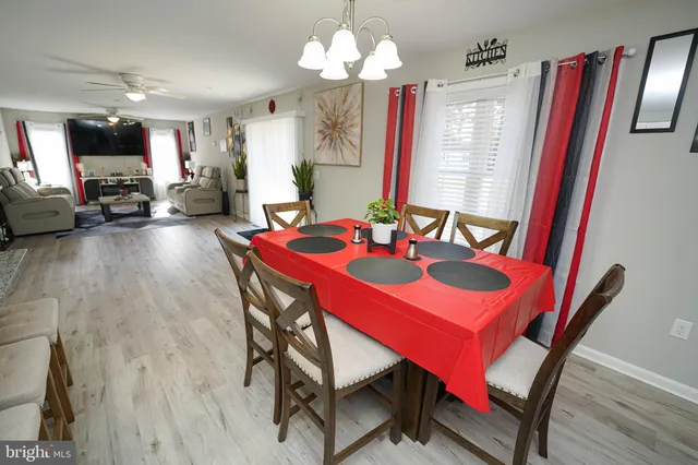 a view of a dining room with furniture and a livingroom