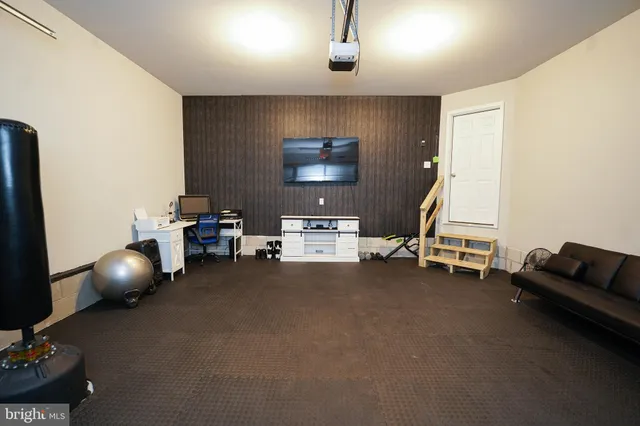 a view of a livingroom with furniture and a window
