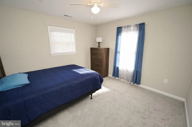 a bedroom with a bed and a cabinets