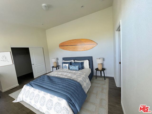 a spacious bathroom with a granite countertop sink and a mirror
